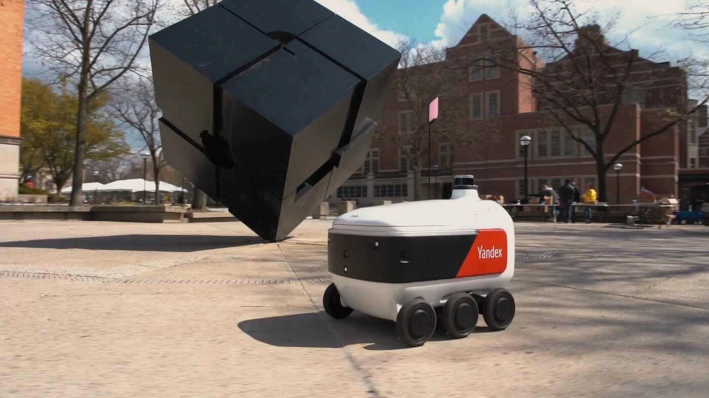 autonomous delivery robot carrying package